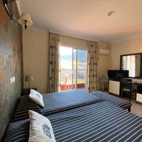 Imagen de la habitación del Hotel La Aldea Suites. Foto 5