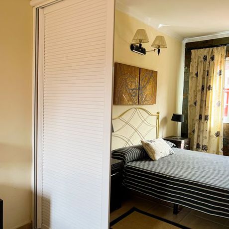 Imagen de la habitación del Hotel La Aldea Suites. Foto 10