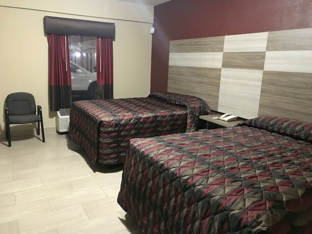 Imagen de la habitación del Hotel La Bella Inn. Foto 17