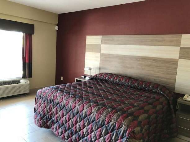 Imagen de la habitación del Hotel La Bella Inn. Foto 18