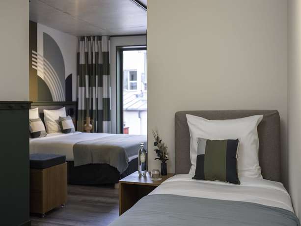 Imagen de la habitación del Hotel La Belle Ville. Foto 11