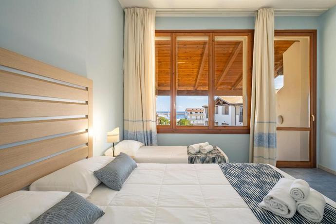 Imagen de la habitación del Hotel La Caletta Village. Foto 6