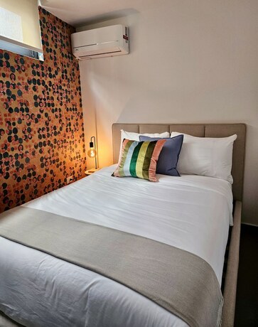 Imagen de la habitación del Hotel La Calma Poshtel. Foto 13