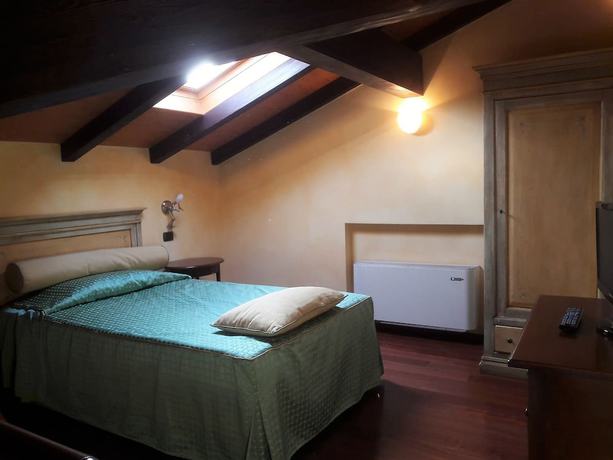 Imagen de la habitación del Hotel La Cantina Residence. Foto 3