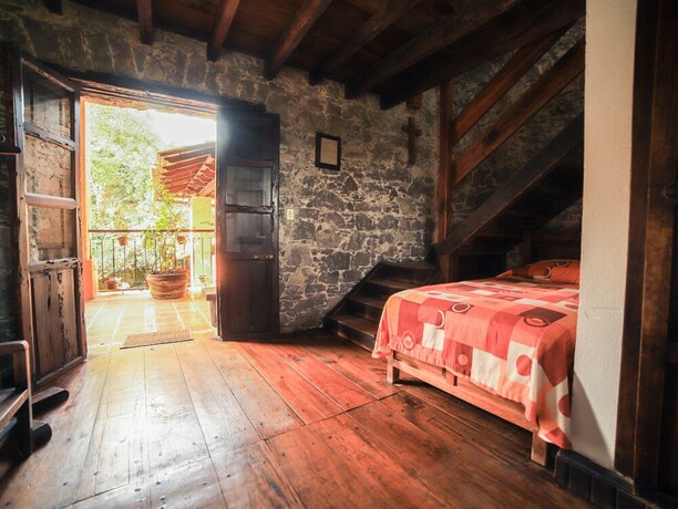 Imagen de la habitación del Hotel La Casa De Piedra By Rotamundos. Foto 12