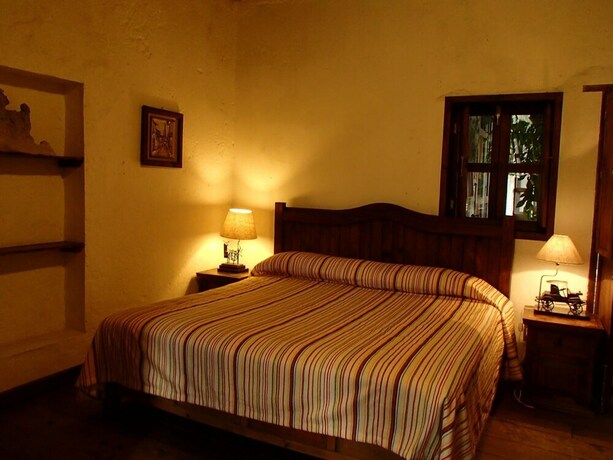 Imagen de la habitación del Hotel La Casa De Piedra By Rotamundos. Foto 21