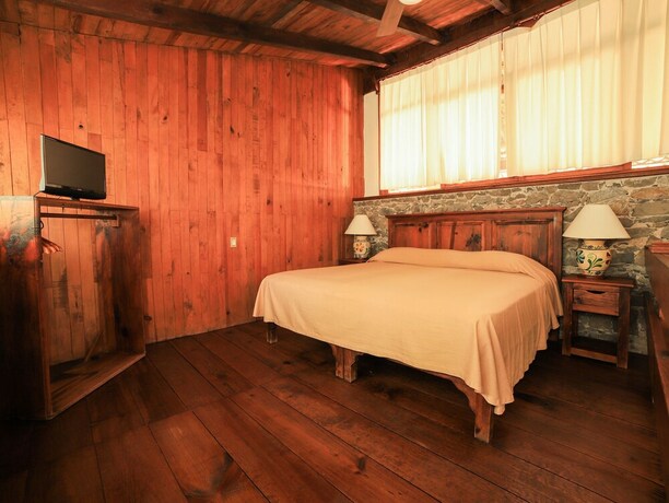 Imagen de la habitación del Hotel La Casa De Piedra By Rotamundos. Foto 24