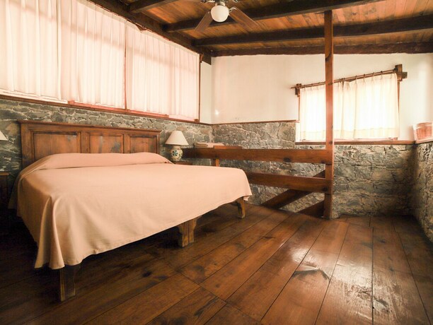 Imagen de la habitación del Hotel La Casa De Piedra By Rotamundos. Foto 25