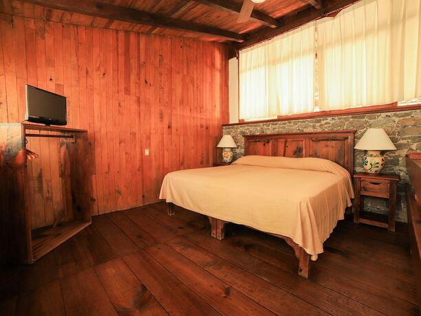 Imagen de la habitación del Hotel La Casa De Piedra By Rotamundos. Foto 32