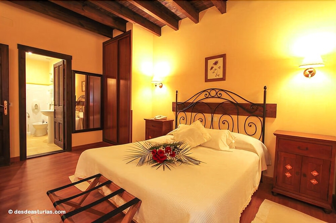 Imagen de la habitación del Hotel La Casona De Nueva. Foto 6