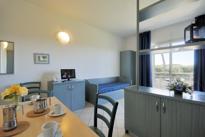 Imagen de la habitación del Hotel La Cecinella Apartments. Foto 4