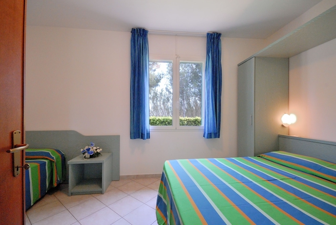 Imagen de la habitación del Hotel La Cecinella Apartments. Foto 6