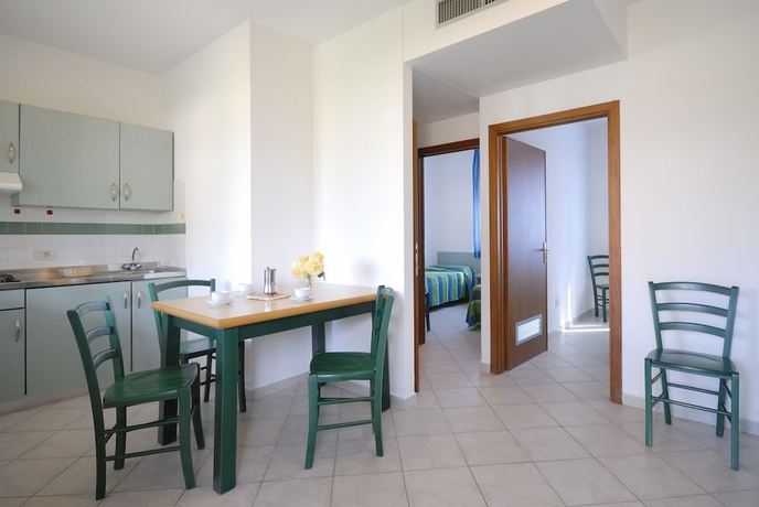 Imagen de la habitación del Hotel La Cecinella Apartments. Foto 7