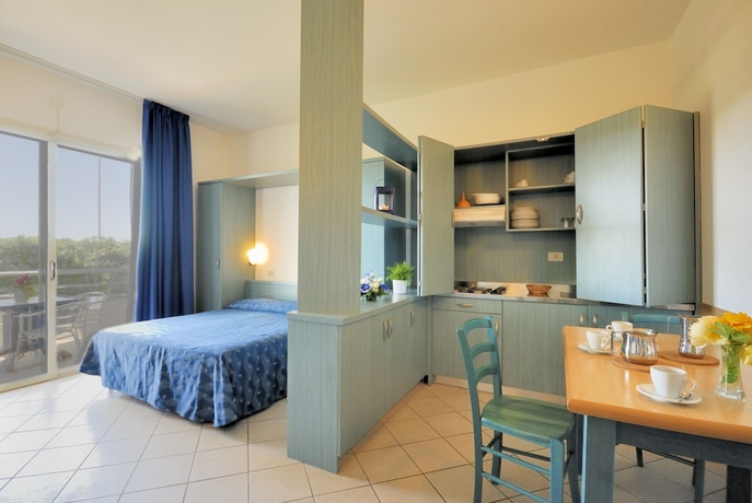 Imagen de la habitación del Hotel La Cecinella Apartments. Foto 11