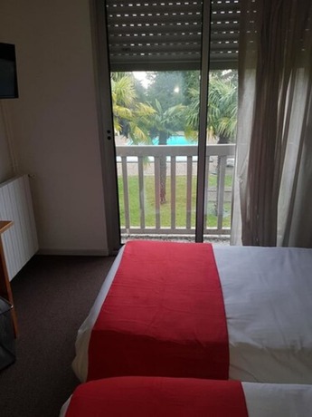 Imagen de la habitación del Hotel La Chaumière du Bois. Foto 16