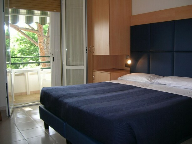 Imagen de la habitación del Hotel La Coccinella. Foto 26