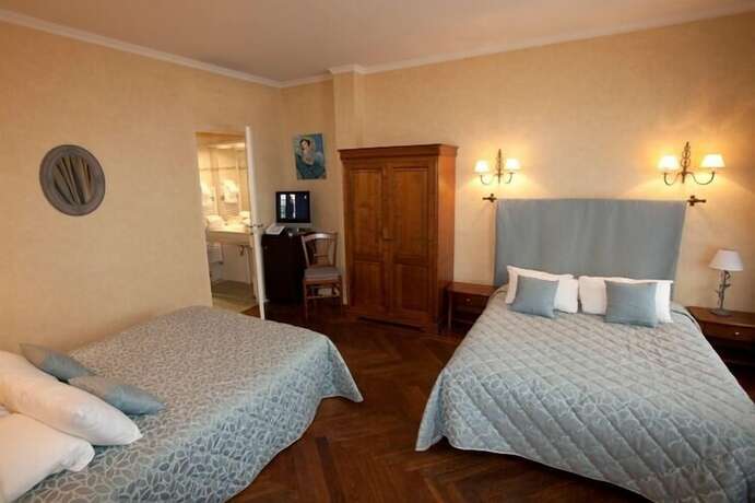 Imagen de la habitación del Hotel La Cour de la Paix. Foto 13