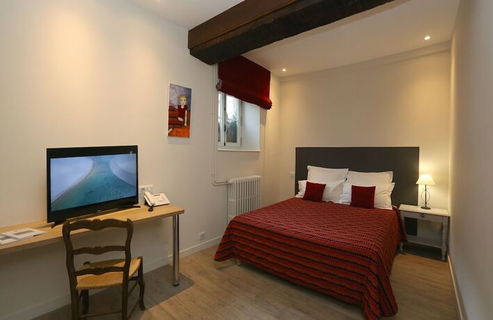 Imagen de la habitación del Hotel La Cour de la Paix. Foto 20
