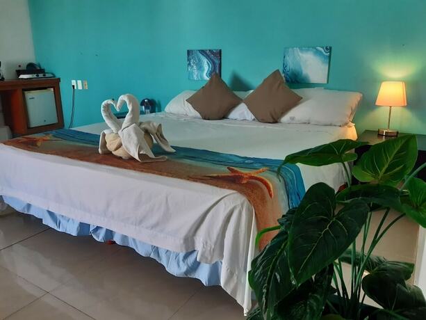 Imagen de la habitación del Hotel La Cultura Suites - Avenida Quinta. Foto 11