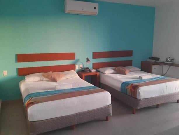 Imagen de la habitación del Hotel La Cultura Suites - Avenida Quinta. Foto 15