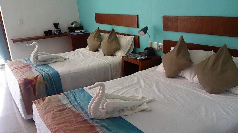 Imagen de la habitación del Hotel La Cultura Suites - Avenida Quinta. Foto 18