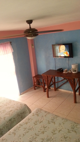 Imagen de la habitación del Hotel La Delphina Bandb Bar and Grill. Foto 8