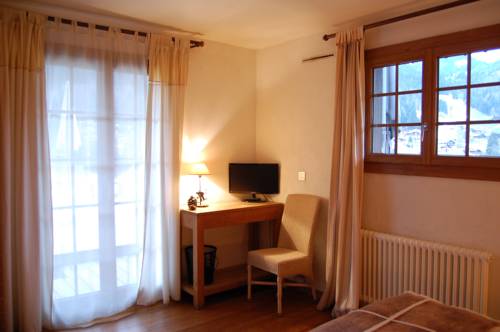 Imagen de la habitación del Hotel La Ferme. Foto 8
