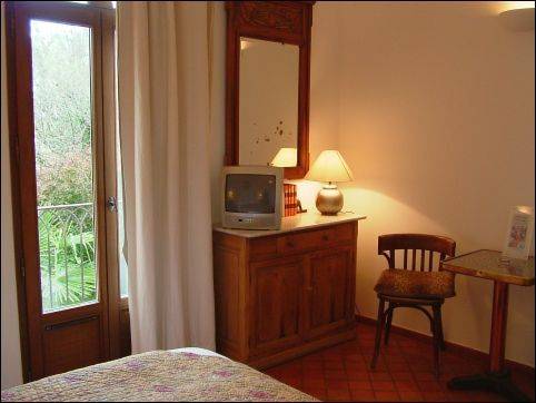 Imagen de la habitación del Hotel La Ferme Rose-hôtel De Charme. Foto 11