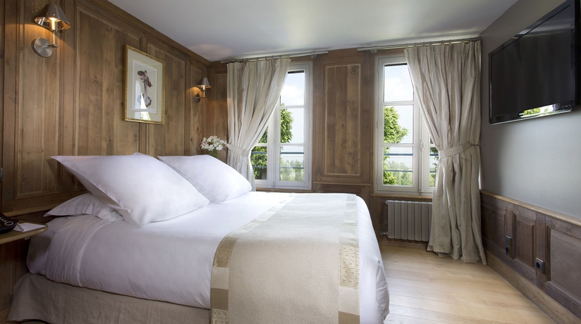 Imagen de la habitación del Hotel La Ferme Saint Simeon. Foto 5