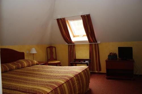 Imagen de la habitación del Hotel La Ferronniere. Foto 20