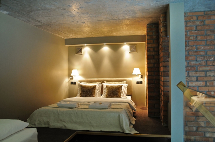 Imagen de la habitación del Hotel La Gioia Designers Lofts Luxury Apartments. Foto 6