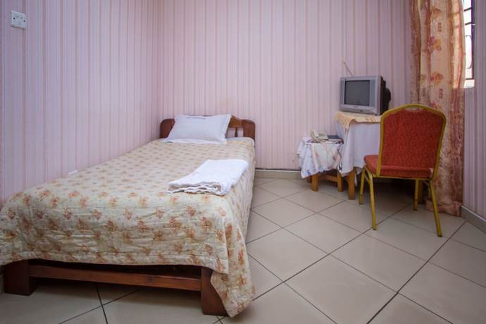 Imagen de la habitación del Hotel La Grand Chez Johnson Muyenga. Foto 10