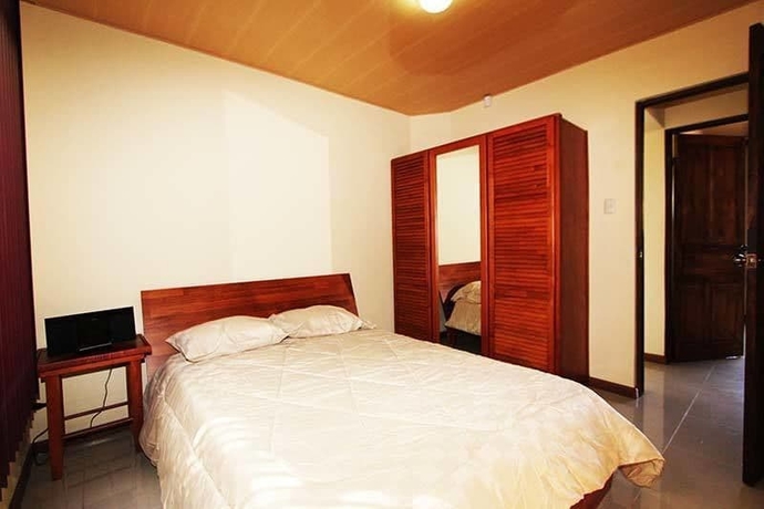 Imagen de la habitación del Hotel La Jacaranda Luxury Condos. Foto 3