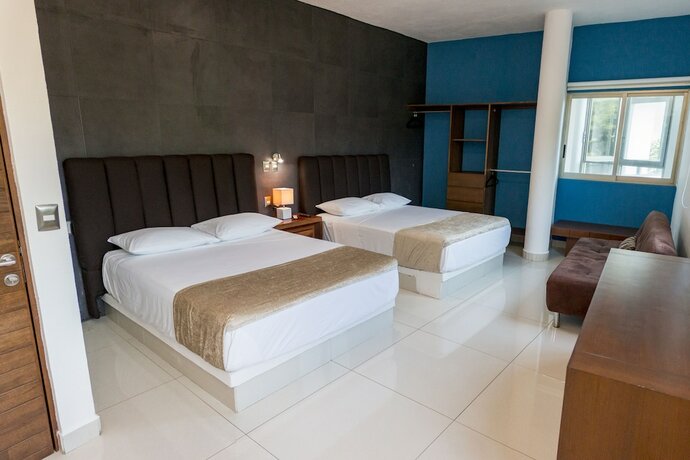 Imagen de la habitación del Hotel La Loma Suites. Foto 18