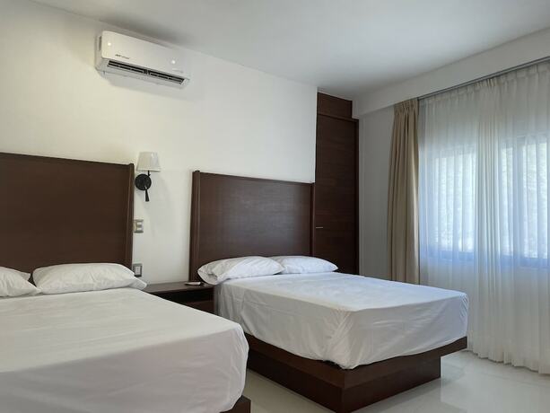 Imagen de la habitación del Hotel La Loma Suites. Foto 19