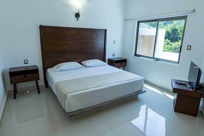 Imagen de la habitación del Hotel La Loma Suites. Foto 20