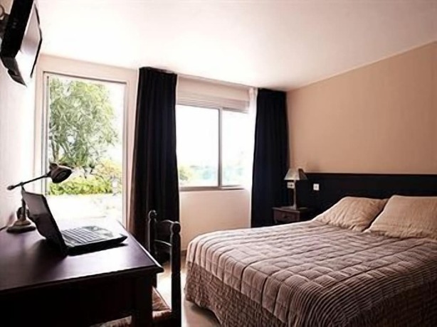 Imagen de la habitación del Hotel La Longue Vue. Foto 19