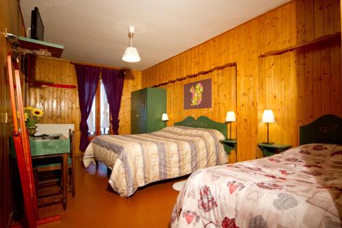 Imagen de la habitación del Hotel La Lucciola. Foto 7