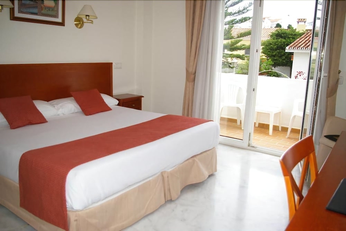 Imagen de la habitación del Hotel La Luna Blanca. Foto 14