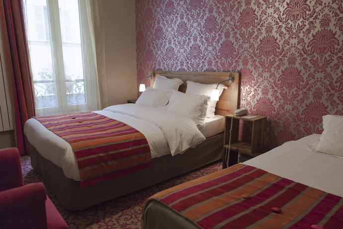 Imagen de la habitación del Hotel La Maison Montparnasse. Foto 11