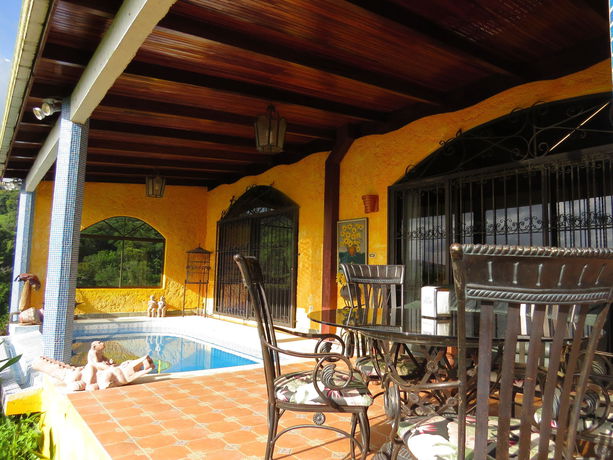 Imagen de la habitación del Hotel La Mansion Inn Arenal. Foto 13