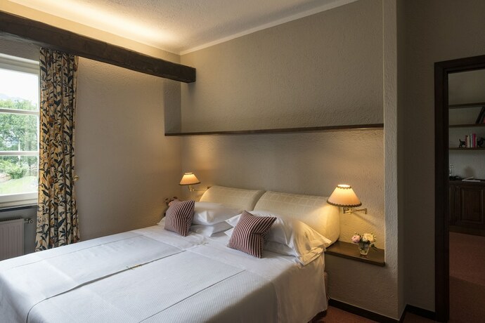 Imagen de la habitación del Hotel La Meridiana Relais and Chateaux. Foto 12