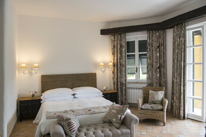 Imagen de la habitación del Hotel La Meridiana Relais and Chateaux. Foto 14