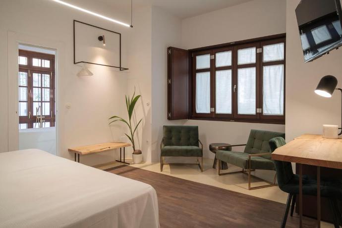 Imagen de la habitación del Hotel La Moderna Suites. Foto 4