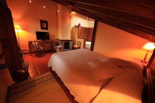 Imagen de la habitación del Hotel La Montaña Mágica Rural. Foto 4