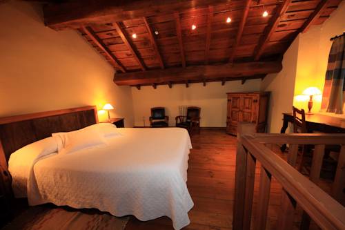 Imagen de la habitación del Hotel La Montaña Mágica Rural. Foto 6