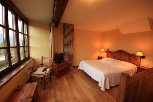 Imagen de la habitación del Hotel La Montaña Mágica Rural. Foto 7