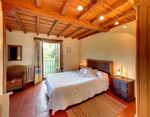 Imagen de la habitación del Hotel La Montaña Mágica Rural. Foto 12