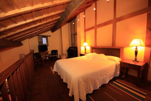 Imagen de la habitación del Hotel La Montaña Mágica Rural. Foto 13