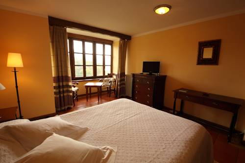 Imagen de la habitación del Hotel La Montaña Mágica Rural. Foto 14